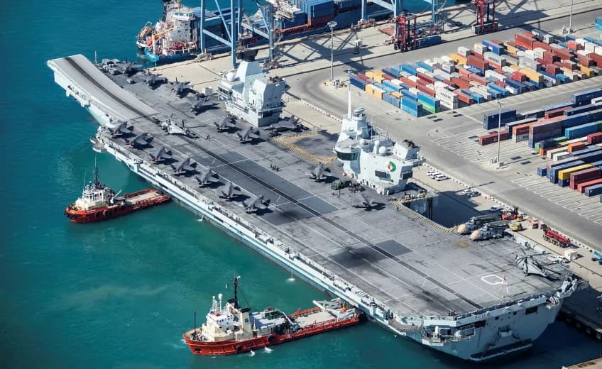 Royal-Navy-HMS-Queen-Elizabeth-beside-dock-with-container-ship Royal-Navy-HMS-Queen-Elizabeth-beside-dock-with-container-ship