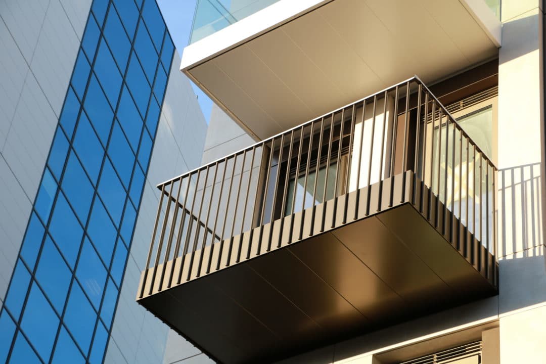 Vertical bar balustrades made with round stainless steel bar. Round bars forming modern looking railing solution