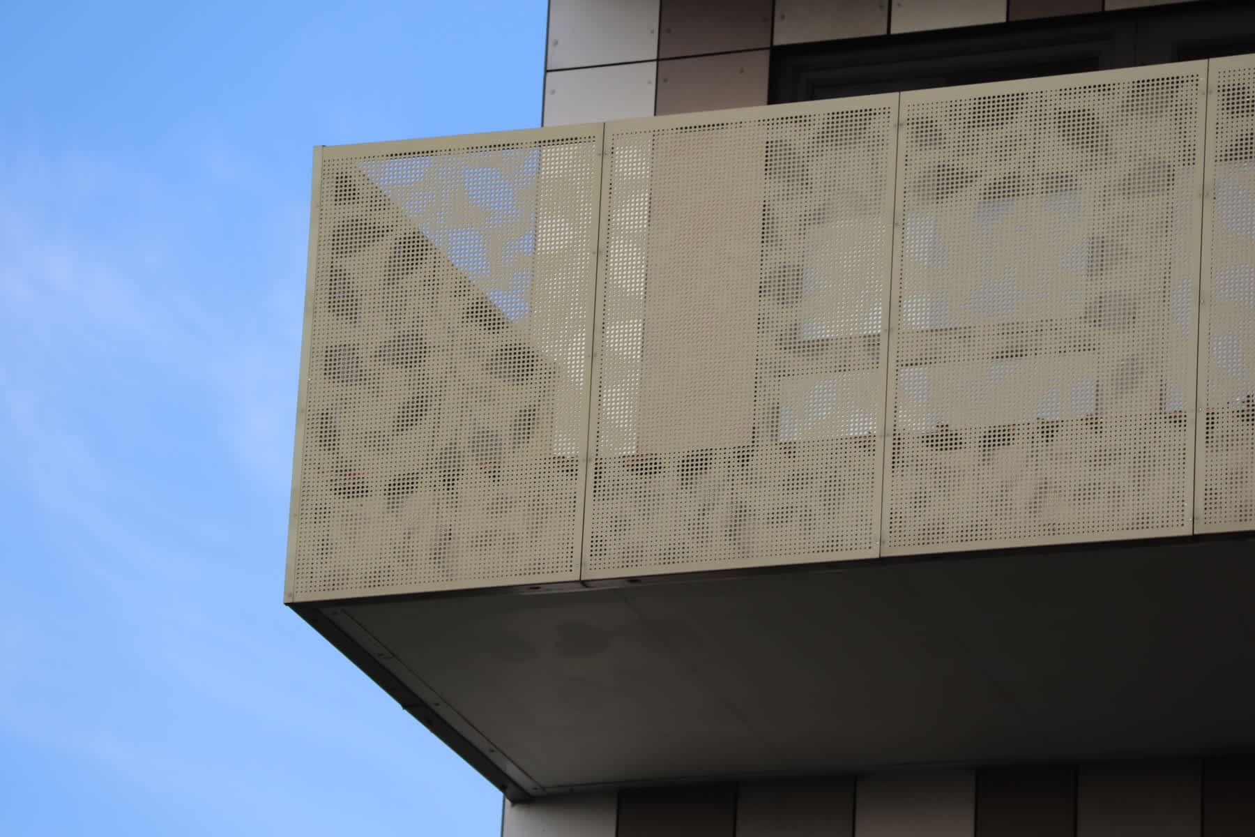 perforated balustrades with leaf pattern perforated into metal panels