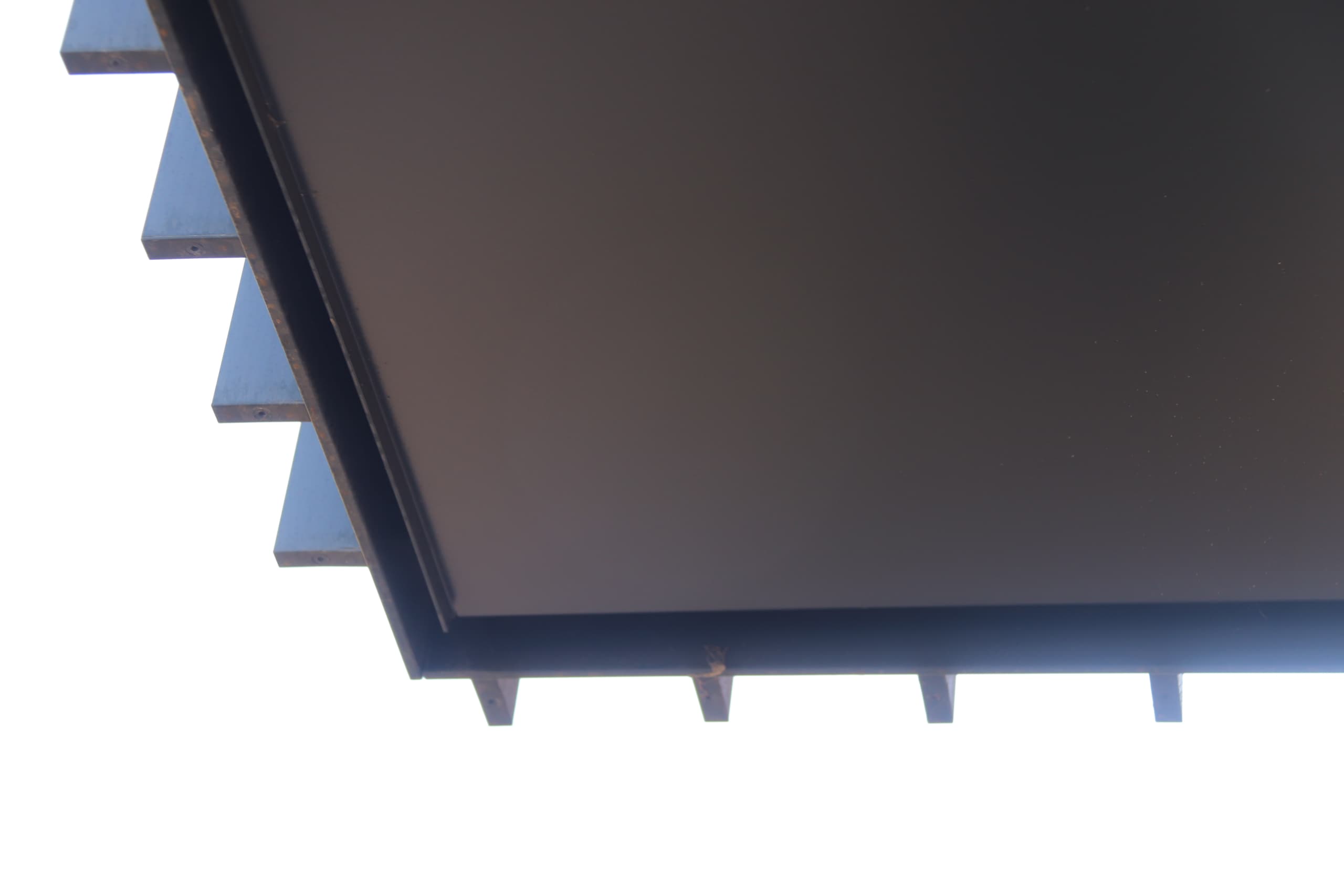 Balcony soffits on underside provide drip edge draining water into front shadow gap on a balcony